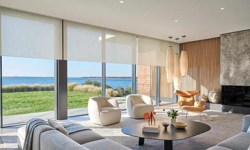 Josh AI Touch panel in a able with a traditional home in the background